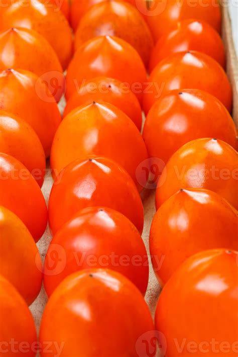 Fresh ripe persimmons in market. Persimmons background. 13863561 Stock ...