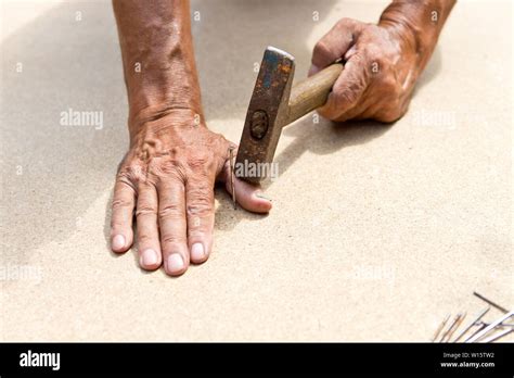 man hit  finger   hammer professional carpentry woodwork