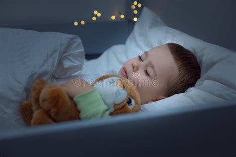 A 3-year-old Child Sleeps in a Cozy Bed, Hugs a Toy, daily Routine Stock Image - Image of ...