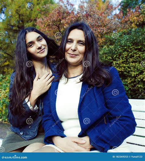 Mature Real Mother with Daughter Outside Autumn Fall in Park
