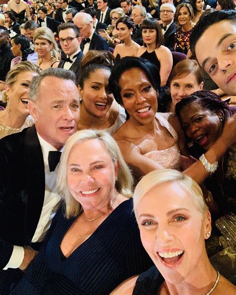 Charlize Theron Takes Epic Oscars Selfie with Tom Hanks, Salma Hayek ...