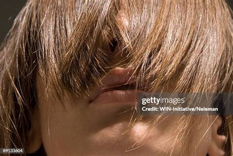 hair covering eyes   premium high res pictures getty images