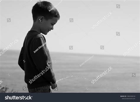 image boy peeing  beach stock photo  shutterstock