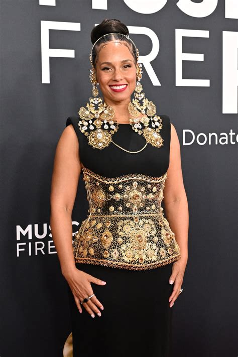 Alicia Keys Wins Gold in D&G Dress & Dramatic Earrings at Grammys 2025