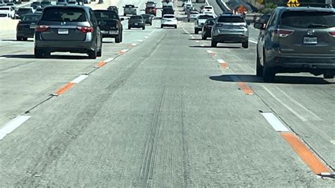 Seeing orange and white lines on the freeway? Here's what they mean