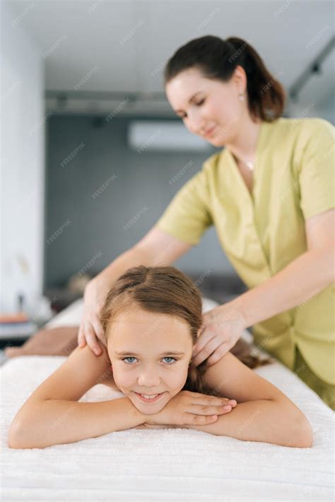 Vertical portrait of happy cute little girl having neck shoulder and