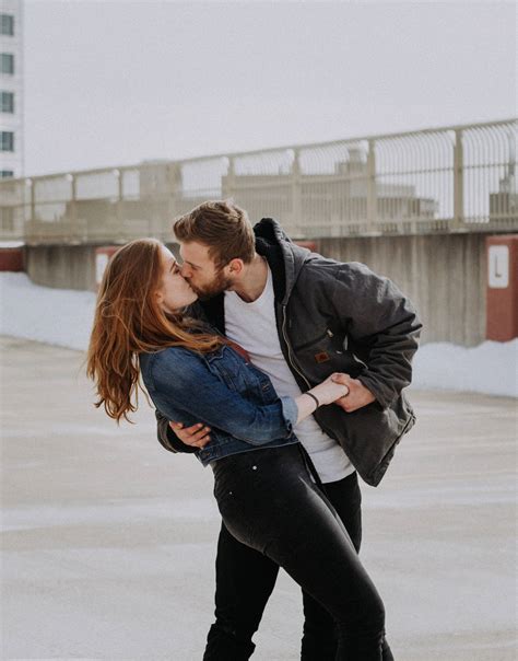 Download Couple Hugging And Kissing In The Snow Wallpaper | Wallpapers.com