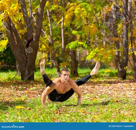 Yoga tittibhasana pose stock photo. Image of fall, muscular - 22673624