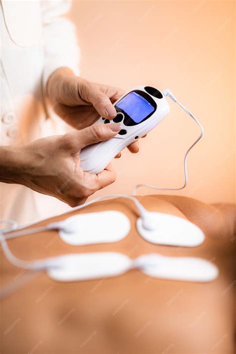 Premium Photo | Upper Back Physical Therapy with TENS Electrode Pads