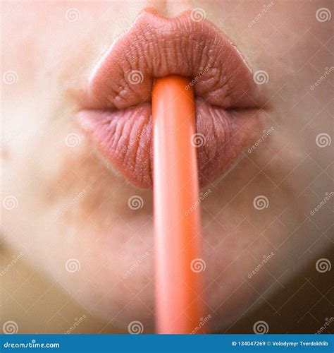 Sip of Freshness. Drinking Straw in Mouth. Sipping Drink through Straw