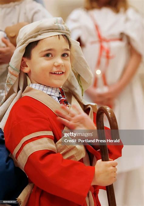 Joseph Lancia of Portland takes a moment to wave to his family while ...