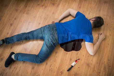 dead man body lying on floor at crime scene | Stock image | Colourbox