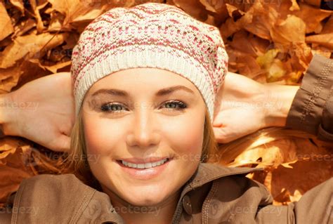 Attractive female on fall foliage 34413642 Stock Photo at Vecteezy