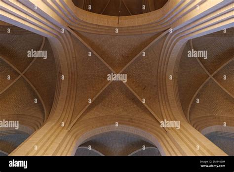 Detail of cream brick vault, arch, rib wall, column and clerestory ...