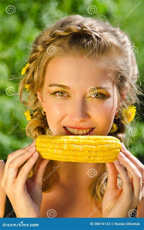 Woman Eating Corn-cob Stock Photos - Image: 28014123