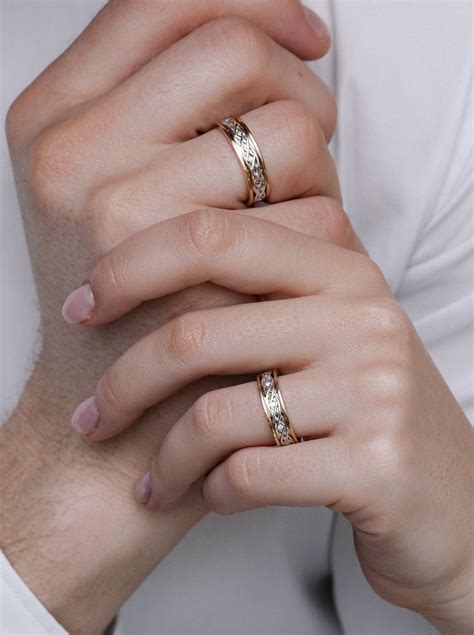 Two-tone wedding rings set with unique design. Gold wedding bands set