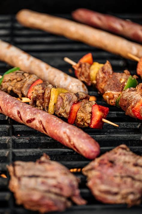 Grilling Sausages and Skewers on a Barbecue Stock Photo - Image of ...