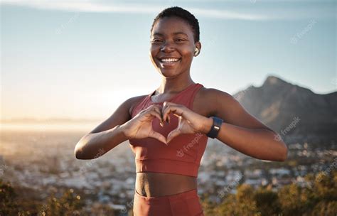 Premium Photo | Black woman fitness and heart hands on mountain with ...