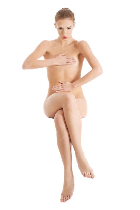 Premium Photo | Full length of naked woman sitting against white background