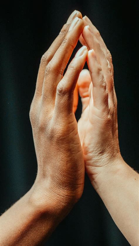 close    people touching   hands  stock photo