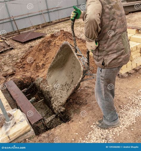 Concrete in a Wheelbarrow at a Construction Site Stock Image - Image of outdoor, hard: 139346083