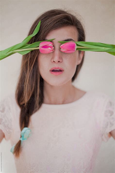 "Cute Vintage Girl With Braid And Fresh Pink Tulips Over Her Eyes" by Stocksy Contributor "Sanja ...