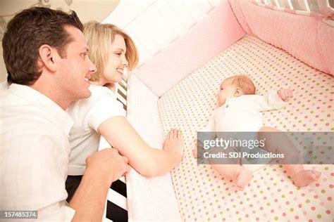 1,047 Mother Looking Into Crib Stock Photos, High-Res Pictures, and ...