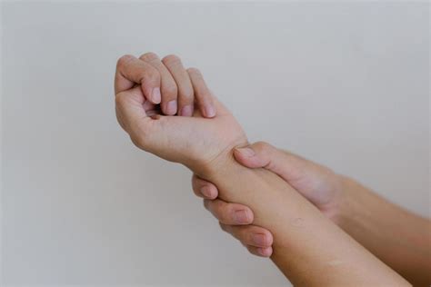 Closeup of hand with hand pain in palm isolated on gray wall background. 15175986 Stock Photo at ...