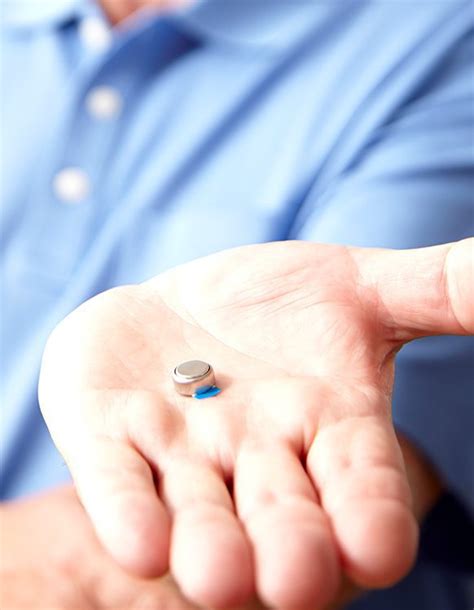how to open hearing aid battery pack with teeth