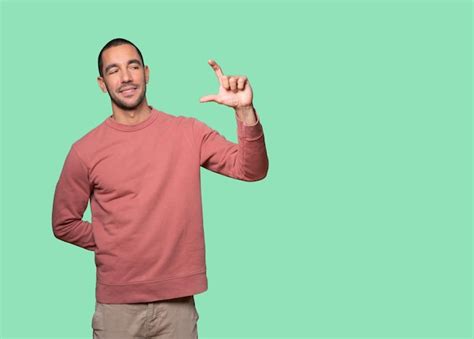 premium photo young man   gesture  small size   hand