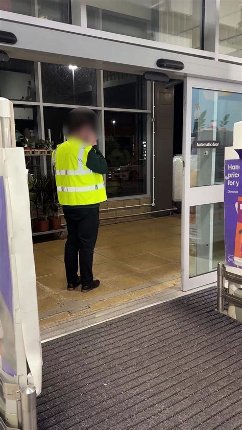 'Smug' shoplifter goads customers as he strolls out of store with bag