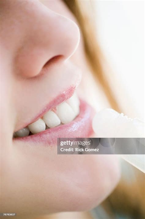 girl applying lip gloss high res stock photo getty images