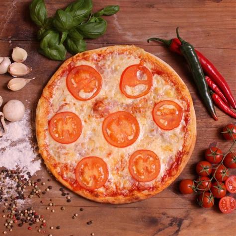 Pizza with sliced tomato