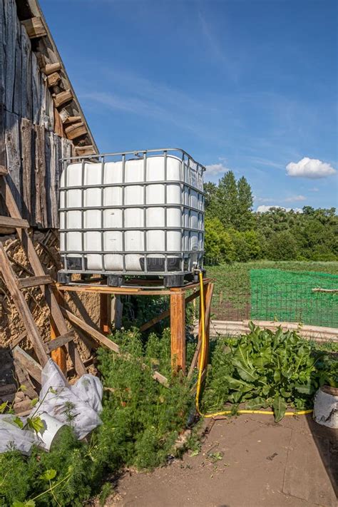 Water Tank for Drip Irrigation in the Garden at the Village House Stock ...