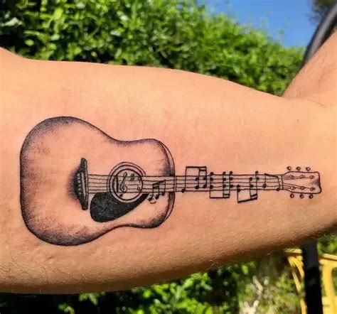 15 Best Guitar Tattoo Designs with Meanings! | Guitar tattoo design ...