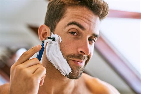 Premium Photo | Portrait man and shaving beard for hair removal ...