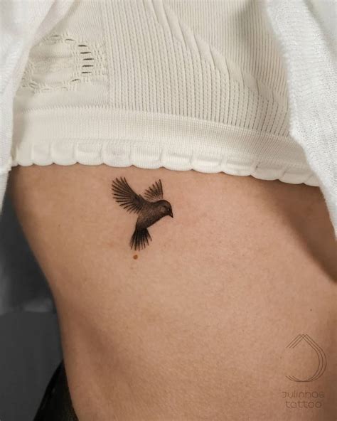 Sparrow tattoo located on the rib.