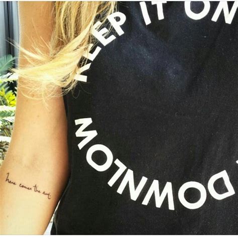 "Here comes the sun" tattoo on Krystal Wilson's