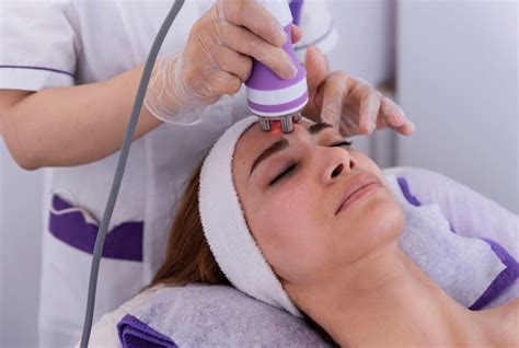 young woman undergoing  facial radiofrequency face lift treatment