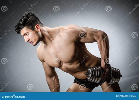 Muscular Ripped Bodybuilder with Dumbbells Stock Image - Image of