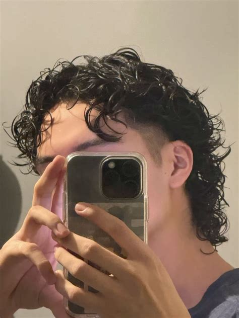 Getting a Black mens curly haircut boosts confidence instantly 6
