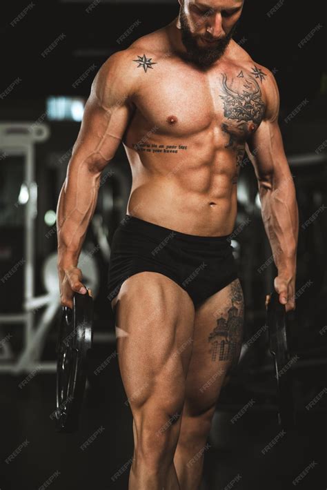 Premium Photo | Shot of a muscular bodybuilder showing his perfect