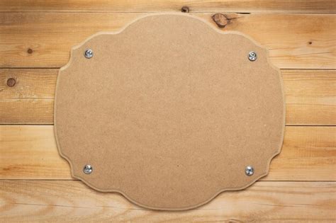 Premium Photo | Nameplate at wooden background