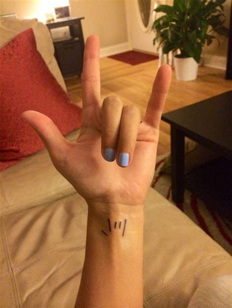 I love you in sign language wrist tattoo | Small tattoos, Beautiful small tattoos, Tattoos for women