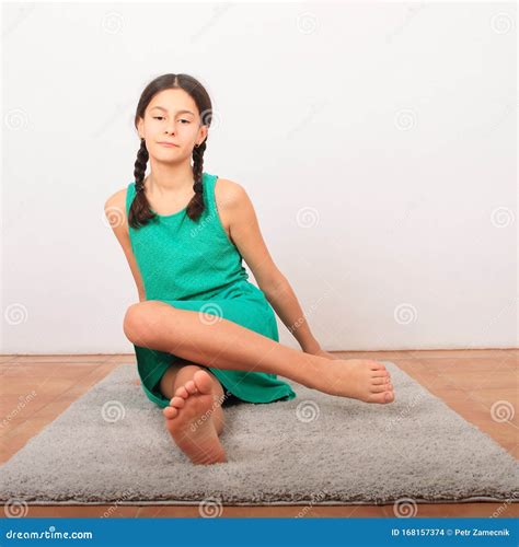 Tween Girl Sitting Barefoot