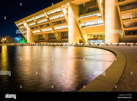 City Hall and a reflecting pool at night, in Dallas, Texas Stock Photo ...