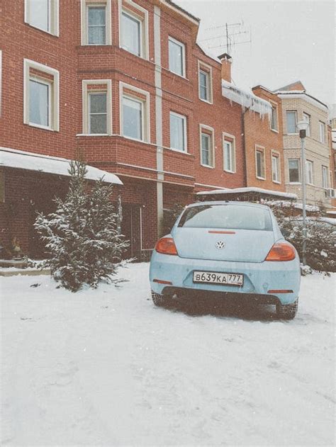 volkswagen beetle  town  snow  stock photo