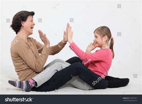 Woman And Girl Clapping Hands Stock Photo 152597357 : Shutterstock