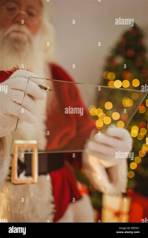 Santa claus writing list on pane Stock Photo - Alamy