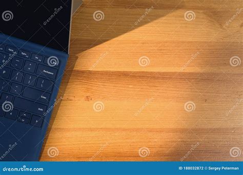 Laptop on wooden table. stock photo. Image of college - 188032872